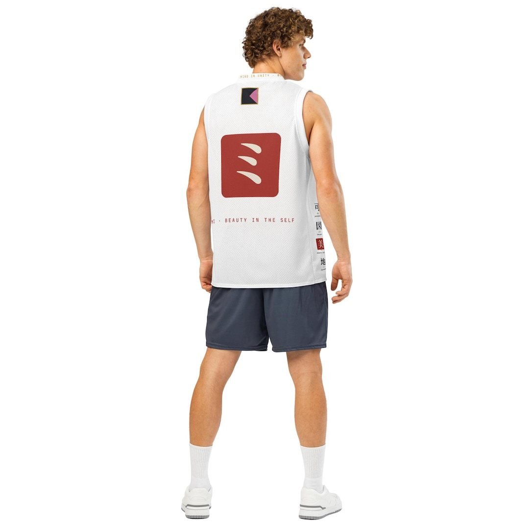 White mesh basketball jersey with a red emblem block on the chest and a gold ring holding katakana across the back.