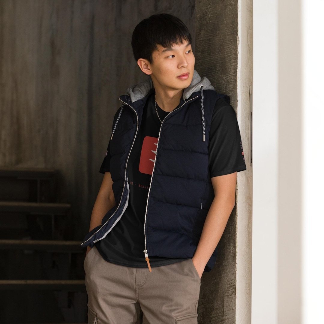 Black cotton t-shirt with a red Kazumizi emblem block printed on the chest.