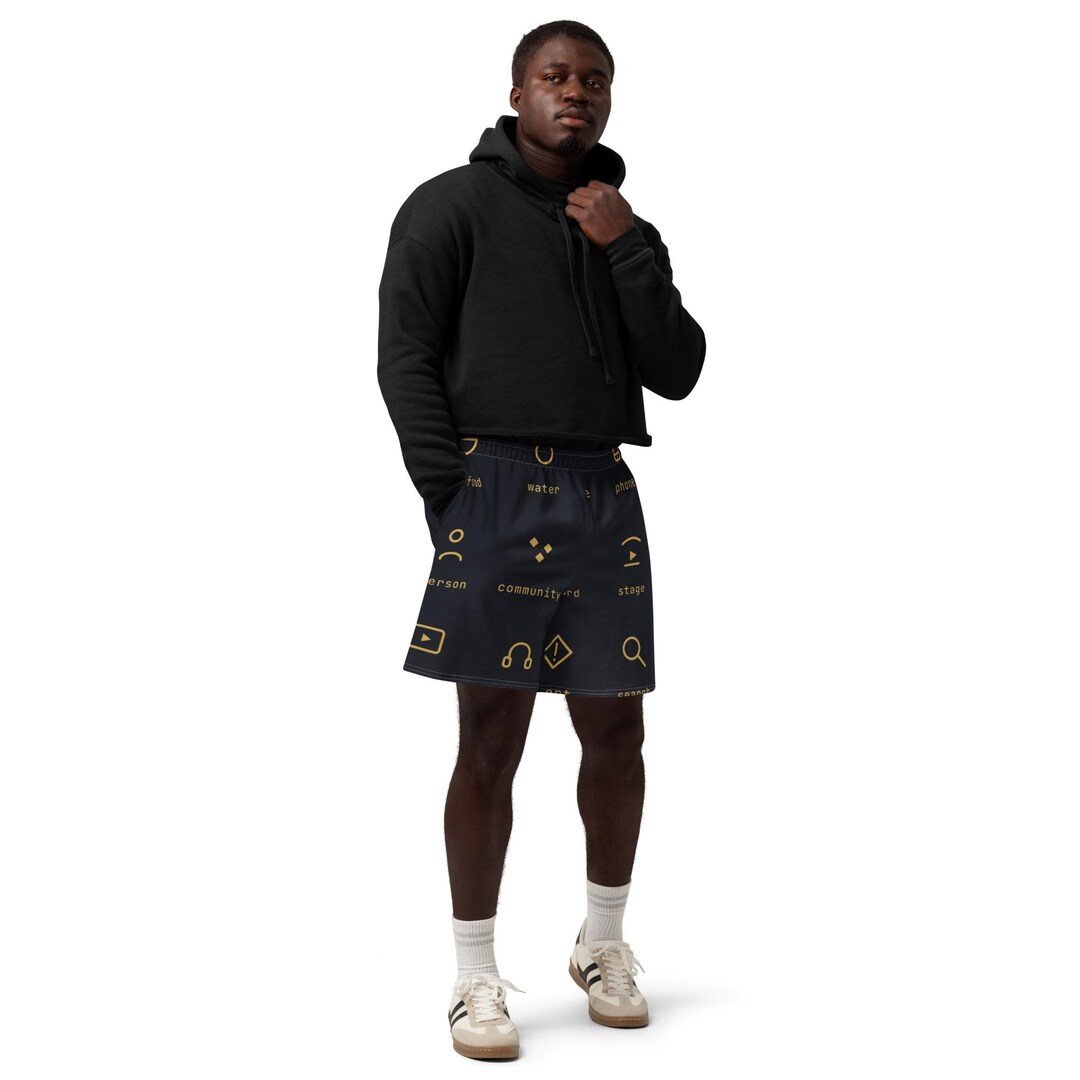 Dark cotton long shorts printed all over with small gold Enfiaré service icons.